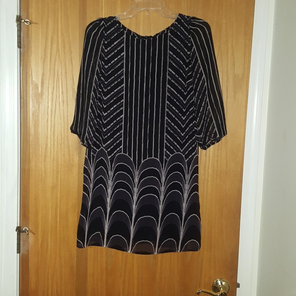 Chic dress, mid-thigh, black and cream.